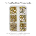Close-up of gold and clear pointed back glass rhinestones in a 6-grid nail art box - 6 Grids Pointed Rhinestones 01 White
