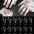 Tabla detallada de tallas para uñas postizas tipo pato con dimensiones en milímetros - Puntas de Uñas de Pico de Pato Largo / 504 Piezas / Transparente