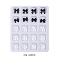 Detailed view of 20 black and white 3D resin butterfly nail art decorations in a tray - Black and White Bows (01#)