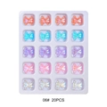 Macro detail of 20pcs 3D aurora butterfly resin nail charms in a plastic storage tray - Aurora Gradient Five-color Bows (06#)