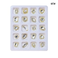Macro detail of 20pcs gold alloy nail art charms with sparkling crystals in a tray - White Alloy Decoration (07#)