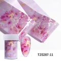 Macro detail of pink and gold marble nail foil roll with sample nail and clear storage jar - Pink Gold Smudge Texture (TZ0287-11)