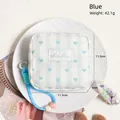 Blue heart striped cosmetic bag with hand strap and logo on a white display tray - Blue