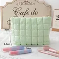 Quilted mint green cosmetic pouch for women with lightweight fabric and zipper closure - Light Green