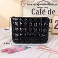 Black quilted puffer makeup bag with gold zipper detail, 20x14cm portable size - Black