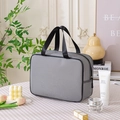Gray mesh toiletry bag with black handles and zipper for large travel storage - Large / Black