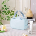 Portable light blue travel toiletry bag with honeycomb texture and dual handles - Medium / Blue
