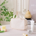 White quilted cosmetic bag with mesh texture and silk handle for travel storage - Medium / Off White