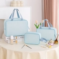 Three-piece light blue waterproof makeup bag set with textured fabric for travel - Three-Piece Set / Blue