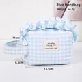 Blue gingham makeup bag with ruffled edges and portable handle measuring 13.5x11x6.5cm - Light Blue
