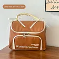 Grande borsa cosmetica marrone caramello con manico crema a balze e fiocco decorativo - Marrone Grande
