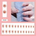 Close-up of pink gradient press-on nails featuring gold foil accents and glitter details - R389 Gradient Flakes Glue Style