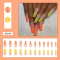 Long coffin press on nails with orange and yellow flame design over pink translucent base - Neon Flame Pattern (W044) / Glue Type
