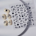 Black music note nail stickers with cartoon eyes and sheet music design on white tray - Music Theme Style (FEB-691)