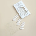 Detail view of almond white press-on nail set with adhesive tabs and minimalist box - Solid White Glossy Style (XH-87-02)