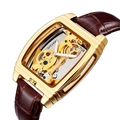 Skeleton mechanical watch with gold tonneau case and brown leather strap on white background - Gold Case Brown Leather Strap