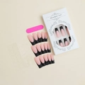 Close-up of French press-on nails with black matte tips and 3D bow details in packaging - Matte Black French Tip with Bow Style(XD-88-52)