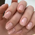 Detalle macro de uñas postizas rosa nude efecto gel con acabado brillante y textura suave - Rosa Nude (XB-60-29)