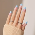 Blue and pink gradient press on nails with white snowflake patterns in almond shape - Blue Pink Gradient Snowflake Almond Style (XH-21-12)