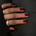 Detail of burgundy red press-on nails paired with a gold pavé screw pattern ring - Burgundy Red (XH-87-30)