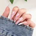 Long coffin false nails with rainbow wave design on light pink base shown on hand - BKS529 Colorful Wave Line French Style (Jelly Glue Edition)
