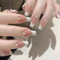 Close-up of long square French press-on nails with nude pink base and pearl detail - M205 Pearl Press-on Nails