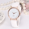 Fashionable quartz watch with white silicone strap and rose gold case on a stylish vanity - White