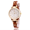 Women's quartz watch with brown leather strap and gold case on white background - Brown