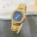 Detail of luxury square gold watch with octagonal diamond bezel and blue textured dial - Gold Blue