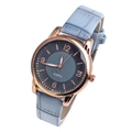 Detailed macro view of the rose gold watch case, grey dial, and light blue leather strap - Light Blue