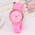 Pink silicone strap watch with rose gold case and quartz dial amidst pearls - Pink