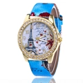 Macro detail of rhinestone bezel and Eiffel Tower dial design on women quartz watch - Cyan
