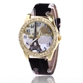Montre femme Tour Eiffel dorée avec lunette en strass et bracelet noir texturé - Noir