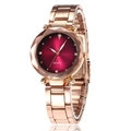 Detail of rose gold quartz watch featuring a faceted crystal bezel and deep red dial - Burgundy