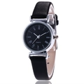 Minimalist quartz watch with black leather strap and Roman numeral dial on white background - Black