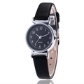 Minimalist women's quartz watch with black leather strap and silver case on white background - Black