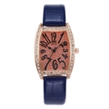 Detail of rose gold tonneau watch with rhinestone bezel and orange glitter dial - Blue