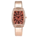 Detail of rose gold tonneau watch case with rhinestones and orange glitter dial - Gold