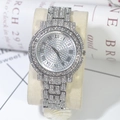 Detail shot of silver iced-out quartz watch with rhinestones and Roman numerals - Silver