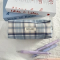 Close-up of the blue checkered pencil case featuring a May Rabbit fabric label - Blue Plaid (Sparkle)