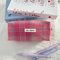 Detail of pink plaid fabric pencil case with white woven label and metal zipper closure - Rose Pink Plaid