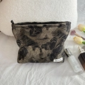 Detail of black and gold butterfly jacquard makeup bag with metal zipper and woven label - Gilded Butterfly Cosmetic Bag (Large)