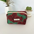 Detail of green floral jacquard pouch with orchid patterns and MAY RABBIT woven label - Pomegranate Flower / Medium Storage Bag