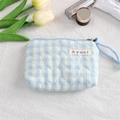 Detail of light blue quilted heart pouch with grid pattern and woven wrist strap - Blue Grid (Grid Heart)