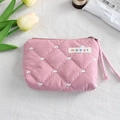 Detailed view of pink quilted storage bag featuring white heart embroidery and zipper - Pink Quilted (Pink Quilted Heart)