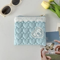 Detail of light blue quilted heart pouch with white lace trim and pearl zipper pull - Quilted Heart Light Blue