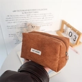 Detailed texture of brown corduroy pouch with May Rabbit label and metal zipper closure - Brown