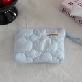Detail of light blue quilted mini pouch with soft cloud texture and May Rabbit label - Quilted Cloud Light Blue