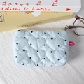 Close-up of heart-quilted light blue coin purse with black polka dots and zipper - Blue Polka Dot Heart