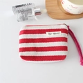 Detail of red and white striped canvas coin purse with May Rabbit label and wrist strap - Red Stripe
